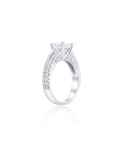 Diamond engagement ring with a central asscher cut diamond and a split shank diamond pave band with smaller diamonds