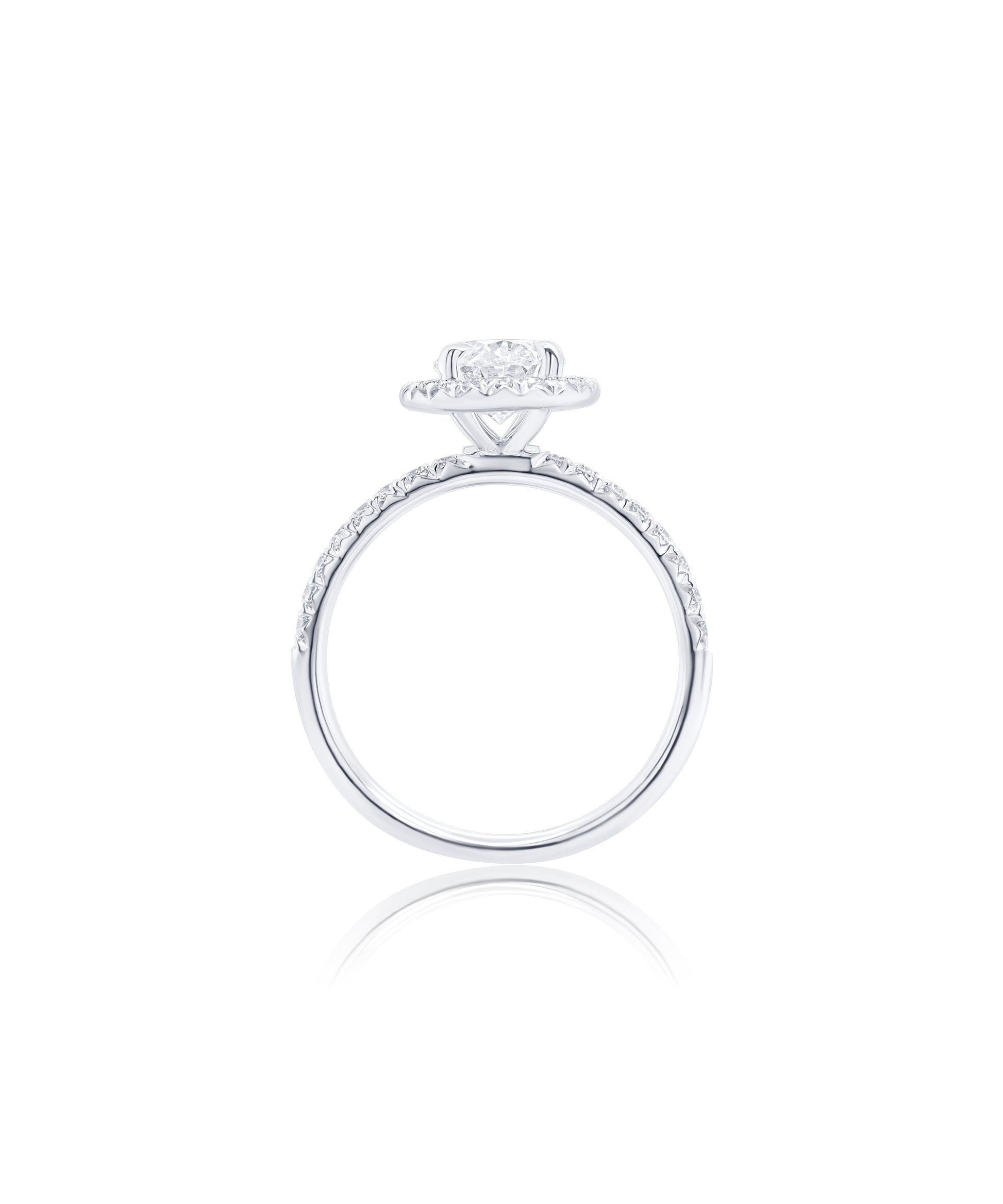 Oval Cut diamond engagement ring set in claw prongs with a diamond halo and band with diamonds pave set halfway around 