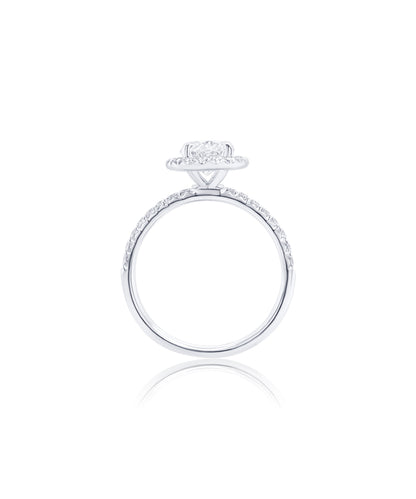 Oval Cut diamond engagement ring set in claw prongs with a diamond halo and band with diamonds pave set halfway around 